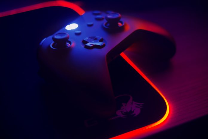 Controller in the dark A game controller lit moodily in the dark