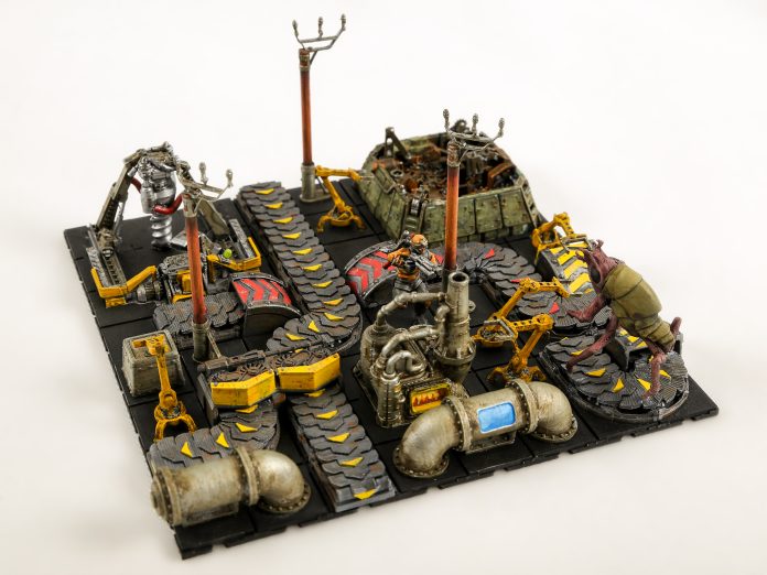 A painted diorama of 3D printed Factorio models, with belts, machines and biters