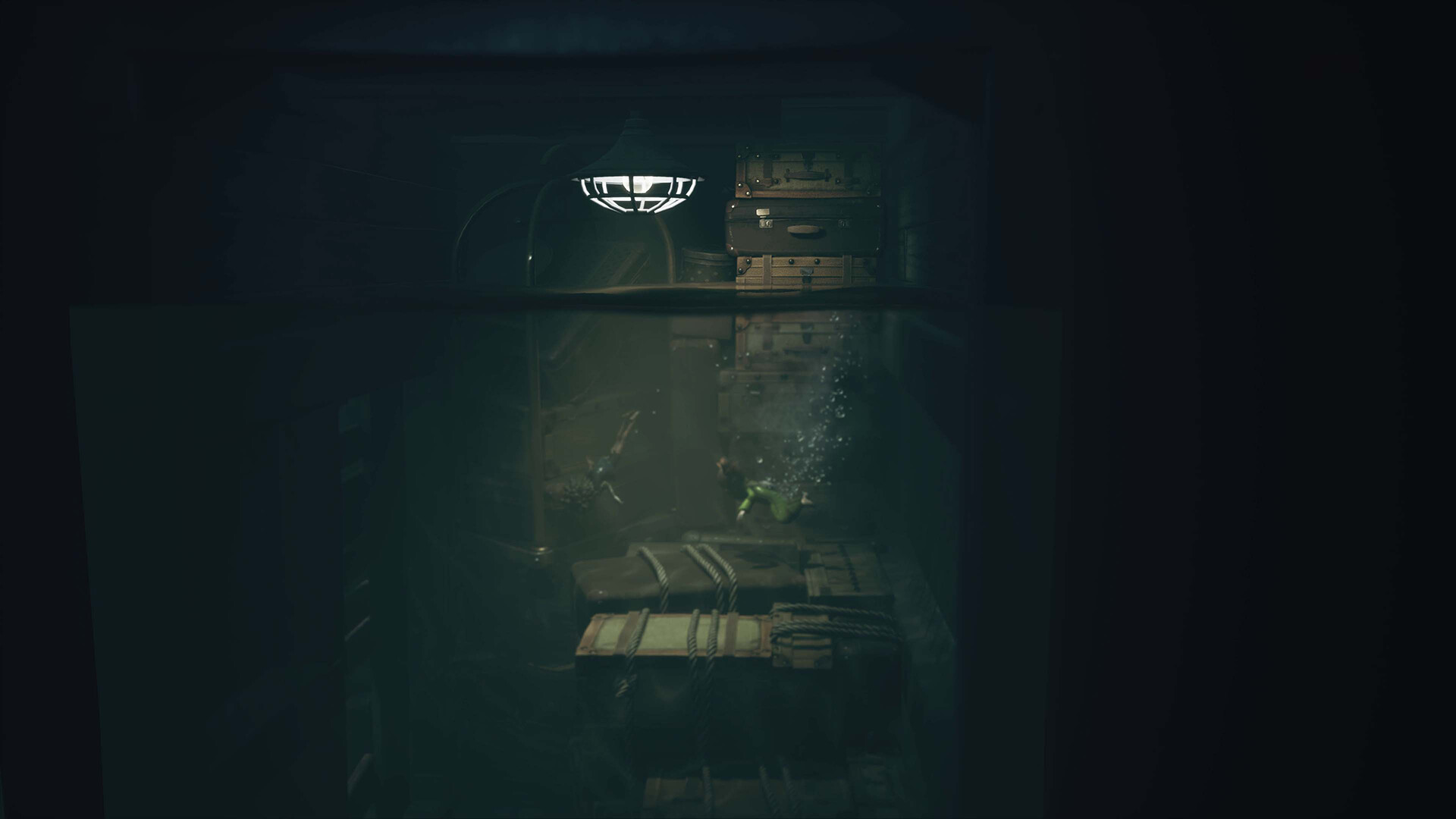 Two small figures swimming through a flooded room past stacked crates in Little Nightmares III - The Shores