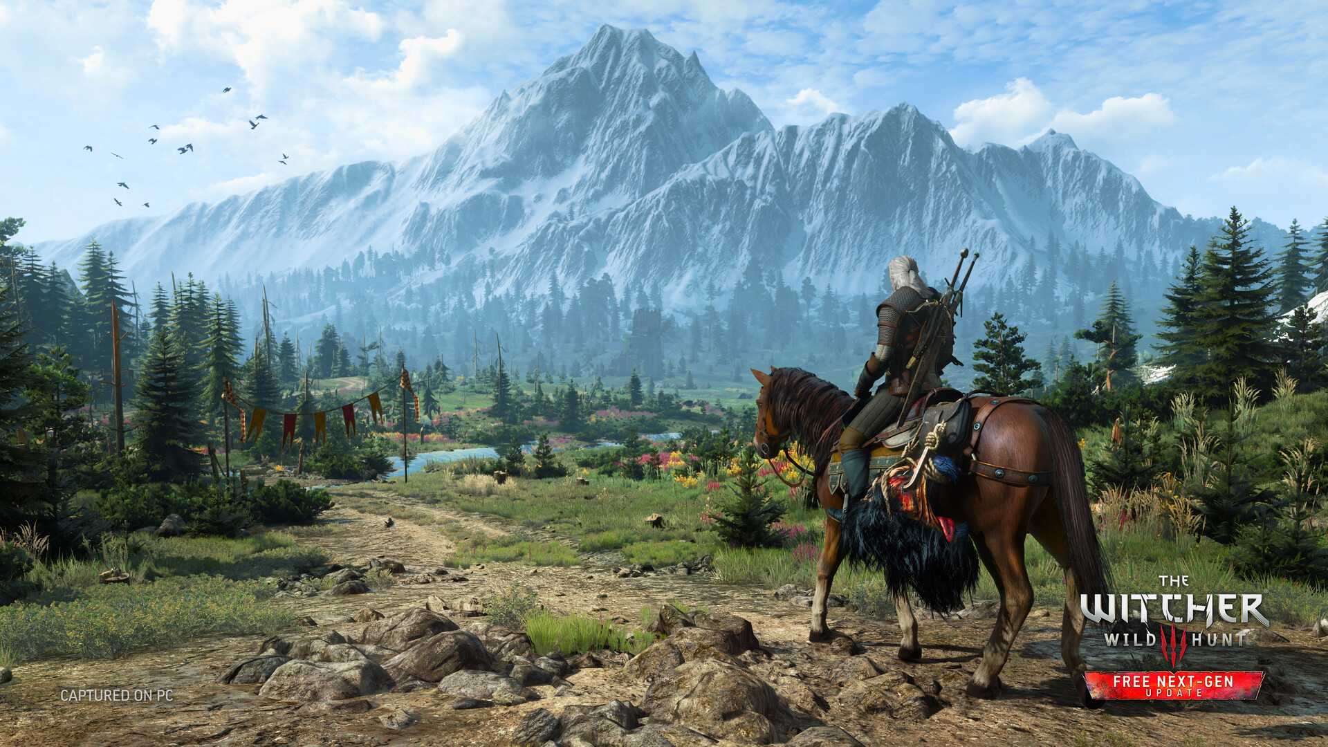 A rider on horseback looks towards a snowy mountain in a The Witcher 3: Wild Hunt screenshot