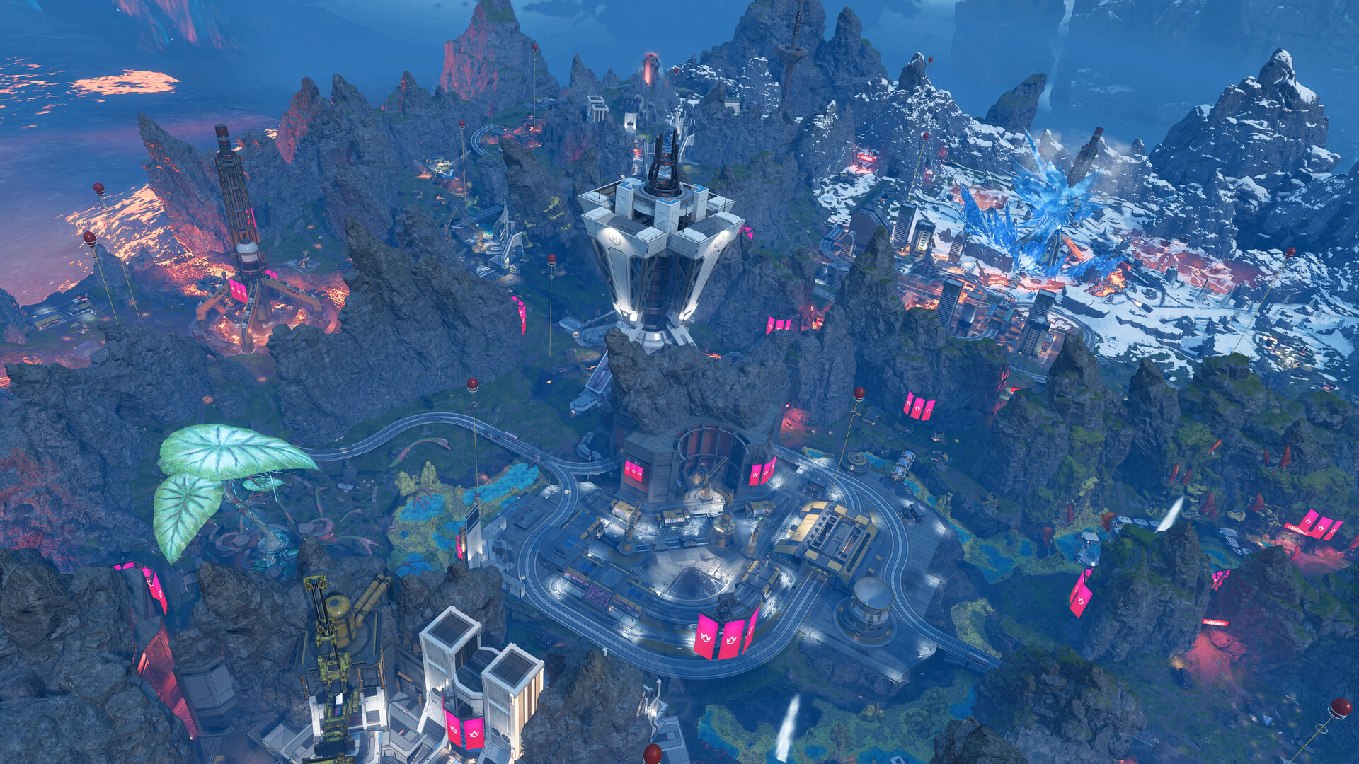 An aerial view of an Apex Legends map with mountains, a lit tower and buildings scattered across rocky ground