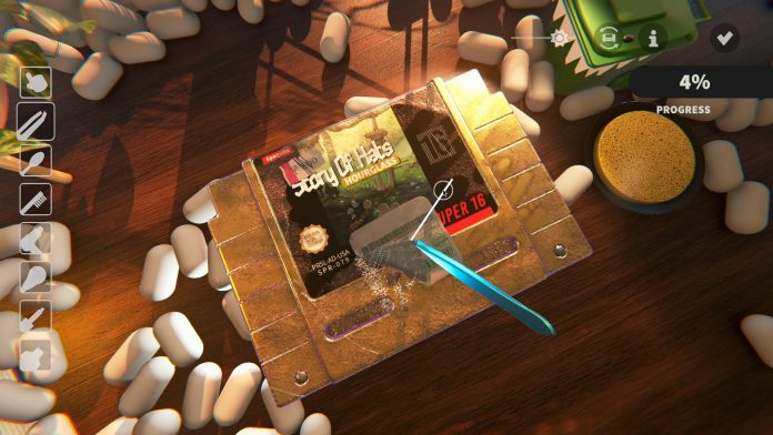 A tweezer peels a sticker from a dusty gold game cartridge labelled Story Of Hats on a wooden bench, with a progress meter at 4 per cent.