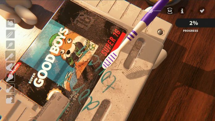 A toothbrush scrubs pen marks off a grimy Super Good Boys cartridge in Cozy Game Restoration