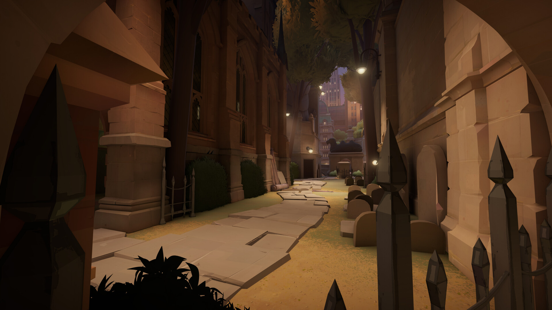 A narrow stone alley beside a church in Deadlock, lit by wall lamps at dusk, with gravestones along the right and a city skyline in the distance.