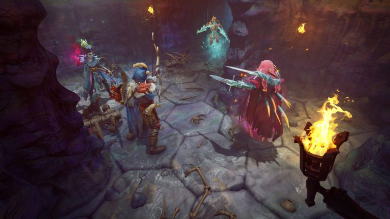 An archer, a sorceress and a clawed enemy in a red hood fight in a torch-lit cave with bones on the floor.