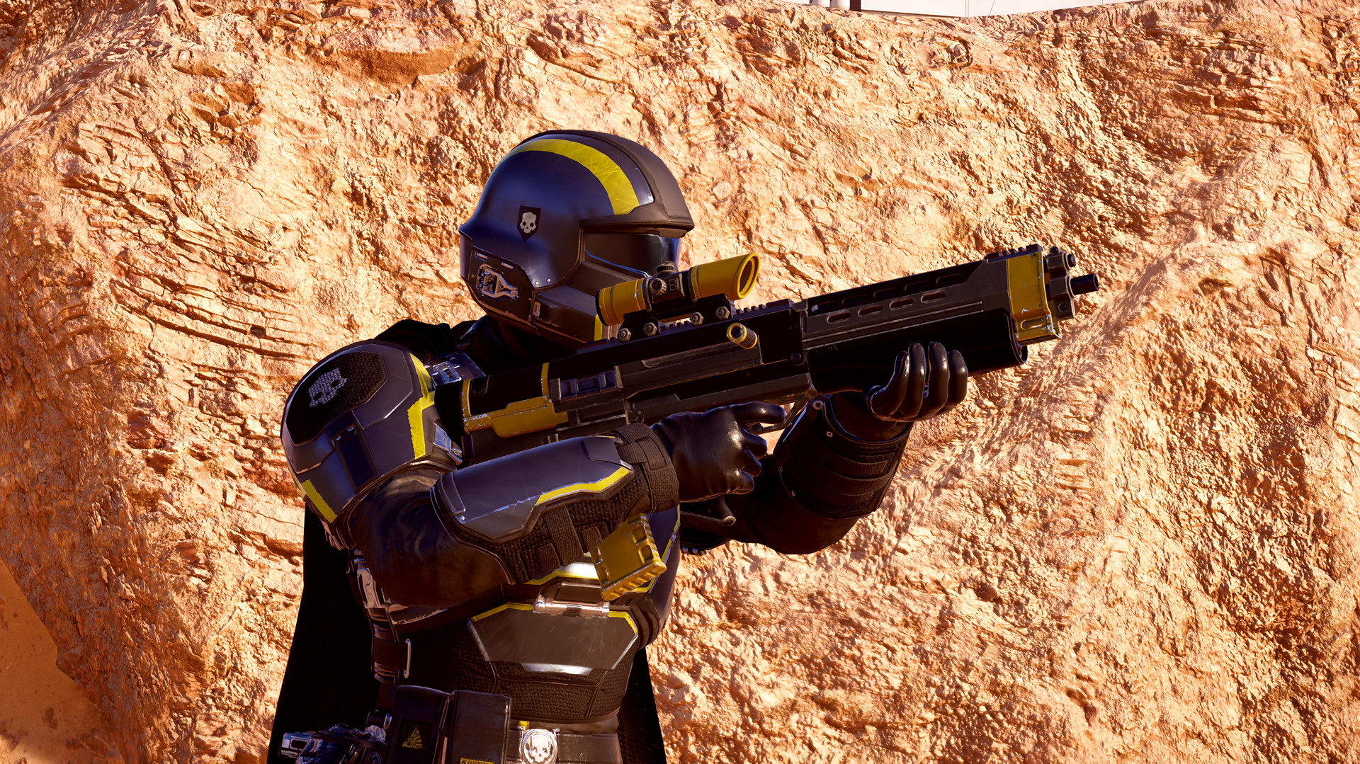 Helldivers 2: a Helldiver in black and yellow armour aims a rifle against an orange rock face