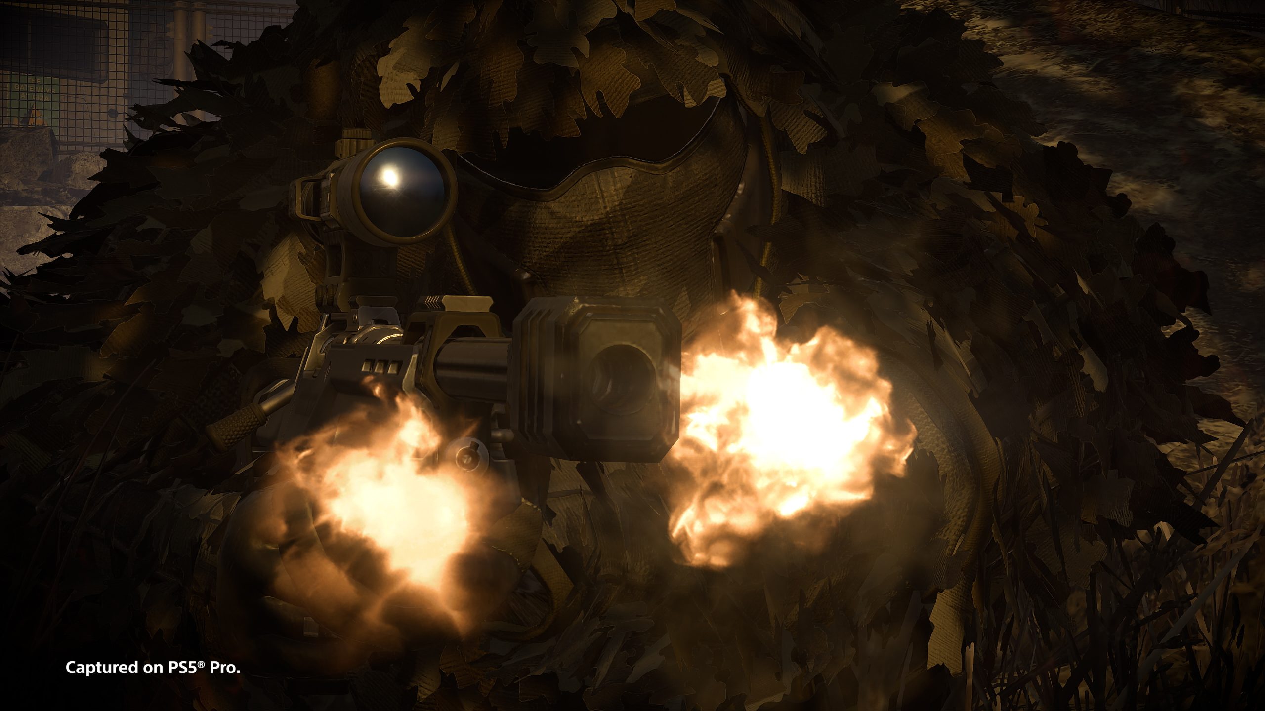 A close view of a Helldiver in a leafy ghillie-style suit firing a scoped rifle, with bright muzzle flashes either side of the barrel