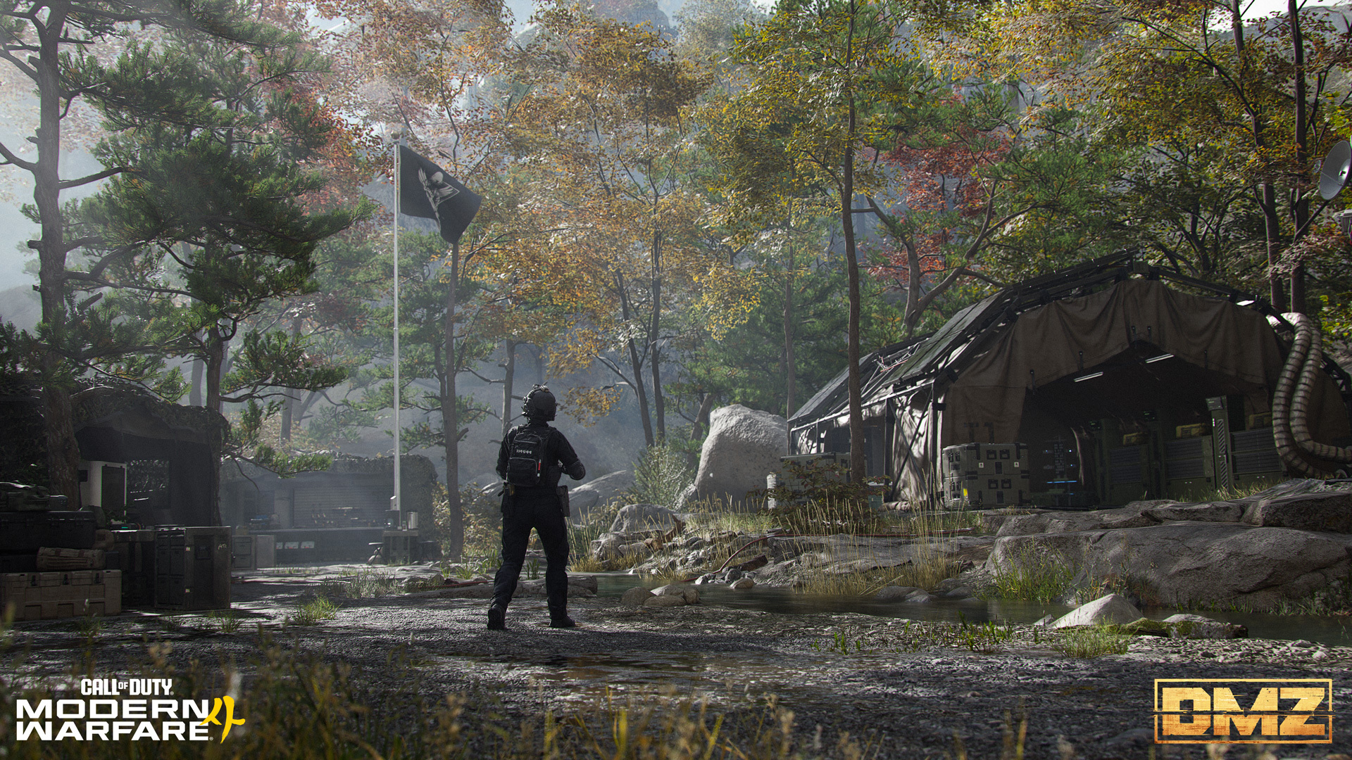 An Operator stands in a wooded camp of tents and crates beneath a flagpole in Modern Warfare 4's DMZ