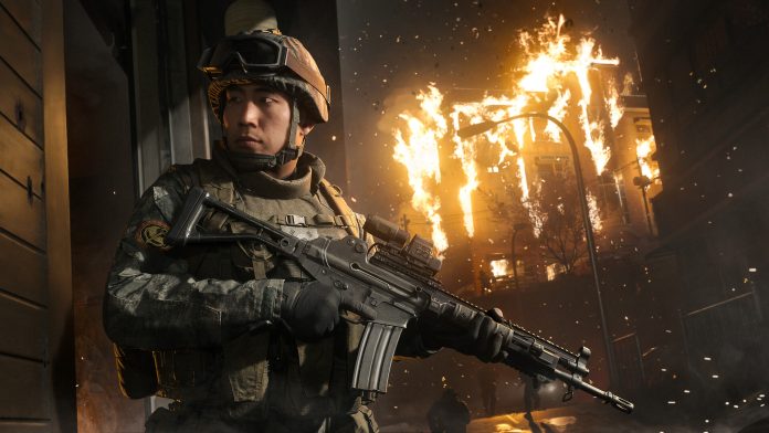 Call of Duty: Modern Warfare 4. A soldier in a helmet and goggles holds a rifle in front of a burning building at night. Image: Activision