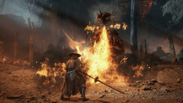 Phantom Blade Zero Soul facing a burning boss screenshot. Image S-GAME A swordsman in a straw hat stands before a towering figure engulfed in flames in Phantom Blade Zero