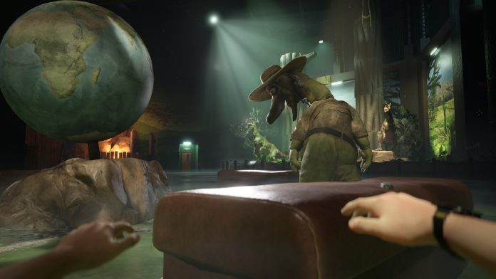 Terrible Lizards Daltons Dinos exhibit hall. Image WDR Studios First-person view of hands on a ledge in a dim dinosaur exhibit hall, with a giant globe and a dinosaur mascot in a safari hat, in Terrible Lizards