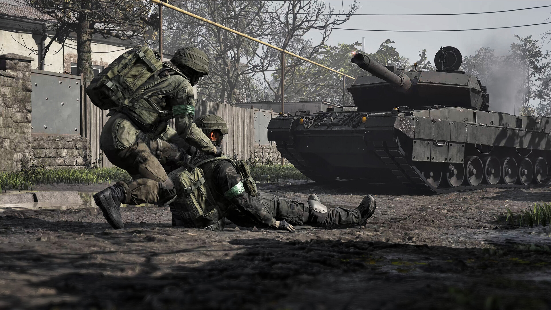 A soldier drags a downed teammate across a muddy street while a battle tank fires behind them in WARDOGS