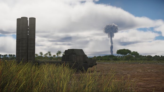 War Thunder: a mushroom cloud rises beyond a row of concrete silos and a tank on a grassy airfield