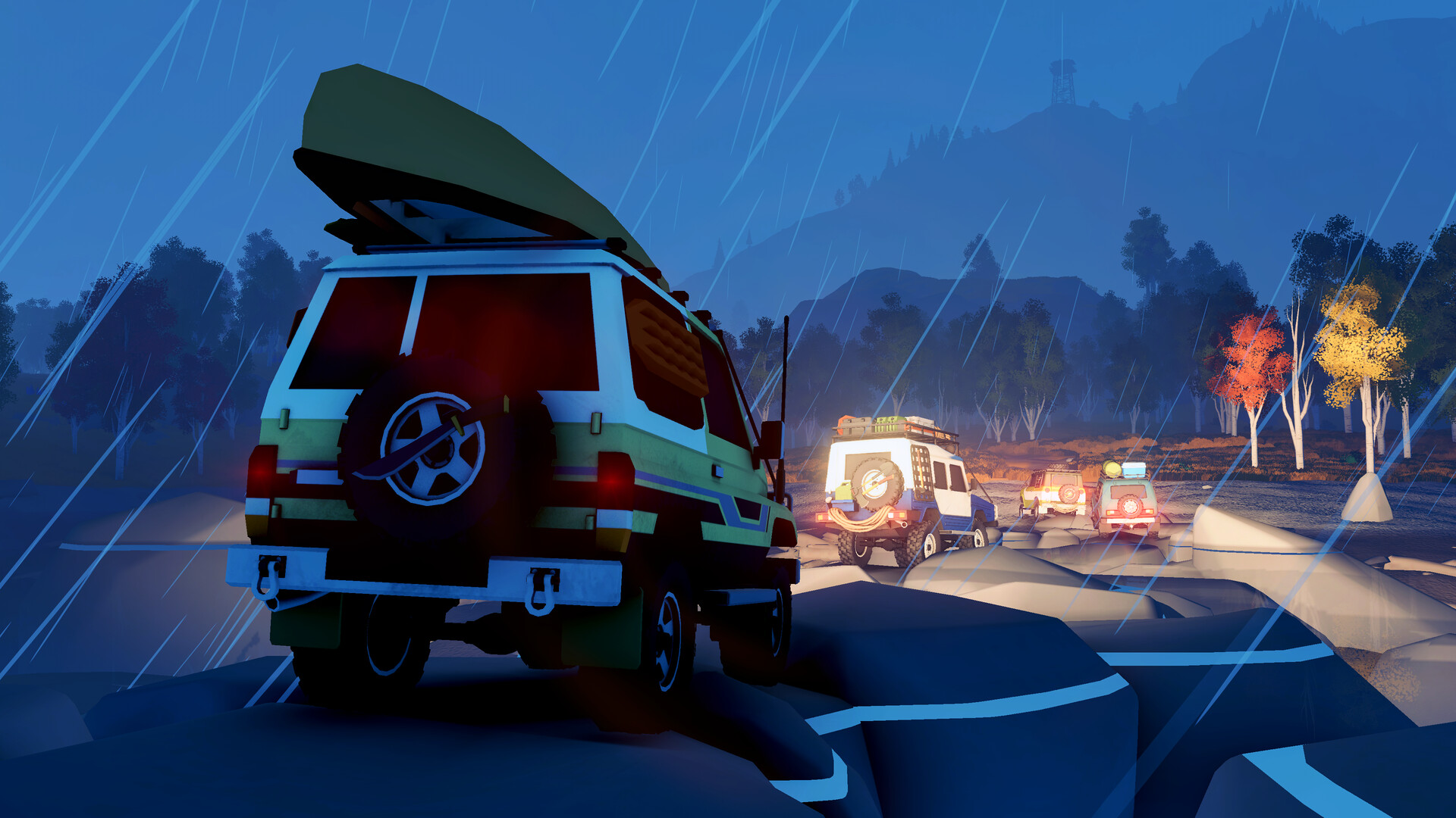 over the hill: a convoy of 4x4s on a rocky ridge in the rain at night.