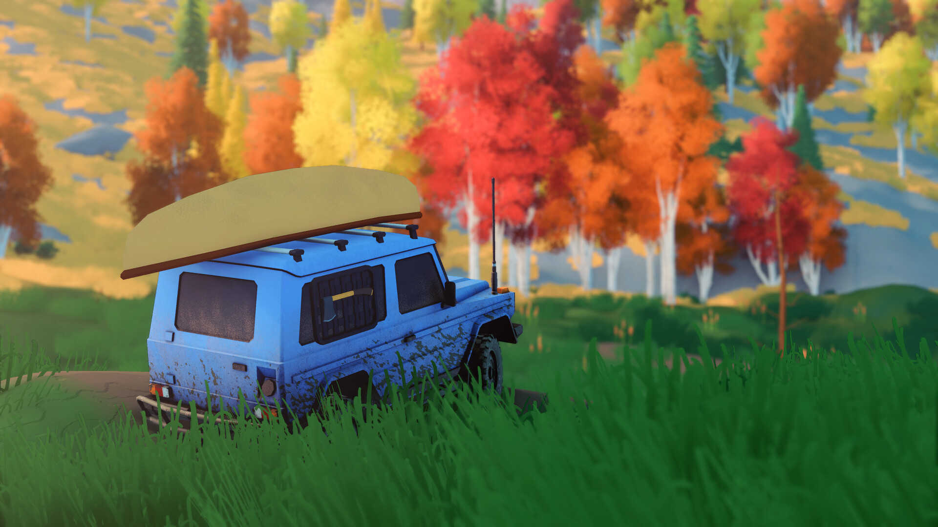 A blue 4x4 with a canoe strapped to its roof parked among red and yellow autumn trees in over the hill